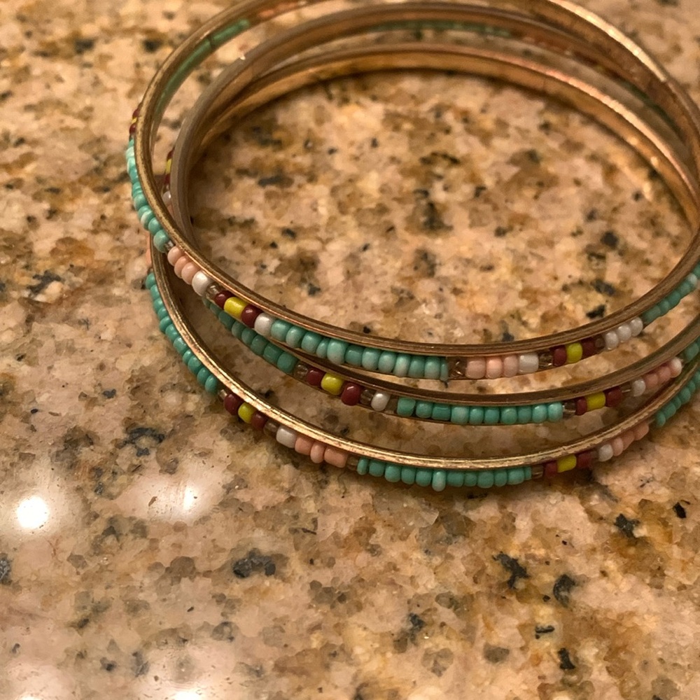 Bracelets with beading.  Gold colored. Set of 3.